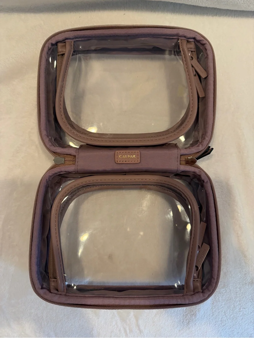 Calpak Small Clear Pink Travel Cosmetic Case in Mauve